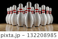 Ten white bowling pins with red stripes arranged in triangular formation on polished wooden lane floor against black background 132208985