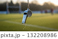 Wet Sports Whistle Hanging with Water Droplets on Athletic Field 132208986