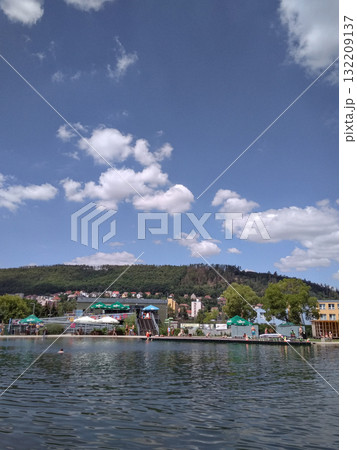 Prague, Czech republic - July 8, 2018: biotop radotin Biokupalisko swimming lake with beautiful blue sky and white clouds in summer 132209137