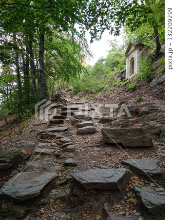 Bezdez, Czech republic - August 2, 2018: Stone steps leading to a small chapel on a hillside near bezdez castle 132209299