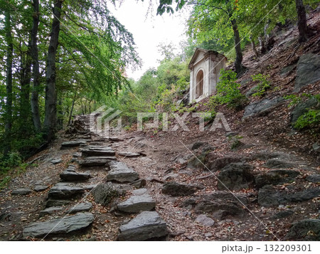 Bezdez, Czech republic - August 2, 2018: Stone path leading to a small temple on a hillside near bezdez castle Bezdez, Czech republic - August 2, 2018: Stone path leading to a small temple on a hillside near bezdez castle 132209301