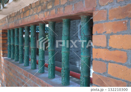 18 Oct 2025 Green Bamboo-Style Balustrade Columns Along Brick Balcony 18 Oct 2025 Green Bamboo-Style Balustrade Columns Along Brick Balcony 132210300