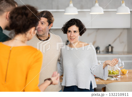 Husband and wife stand side by side and say goodbye to guests 132210911
