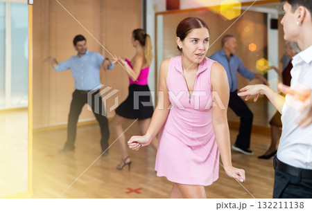 young woman dances salsa 132211138