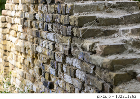 the destroyed ancient brick wall the destroyed ancient brick wall 132211262