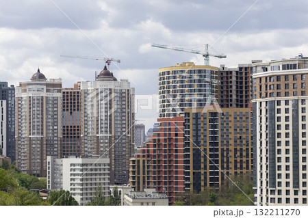 Urban High-Rise Construction with Tower Crane and Modern Apartments 132211270