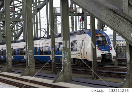 The train moves to the Cologne central station near the Hohenzollern bridge The train moves to the Cologne central station near the Hohenzollern bridge 132211288