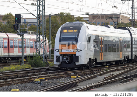 The train moves to the Cologne central station near the Hohenzollern bridge 132211289