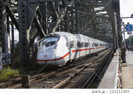 The train moves to the Cologne central station near the Hohenzollern bridge The train moves to the Cologne central station near the Hohenzollern bridge 132211307