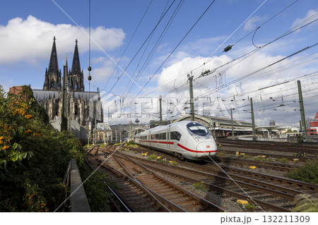The train moves to the Cologne central station near the Hohenzollern bridge 132211309