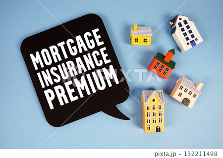 MIP Mortgage Insurance Premium text with house models on blue background 132211498
