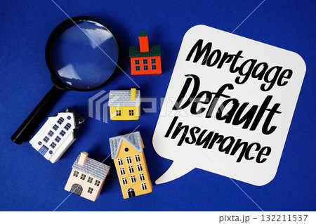 Mortgage Default Insurance text with house models and magnifying glass on blue background 132211537