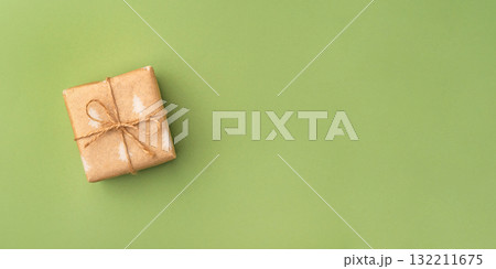 A Christmas gift wrapped in eco-friendly packaging 132211675