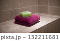 Green Soap Bar on Soft Towel Creating Cozy and Relaxing Bathroom Scene 132211681