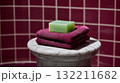 Green Soap Bar and Towels on Marble Stand Representing Self Care and Clean Living 132211682