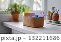 Cozy Home Office Desk with Stationery Organizer and Indoor Plant in Natural Light 132211686
