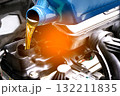 Refueling and pouring oil quality into the engine motor car Transmission and Maintenance Gear .Energy fuel concept. 132211835