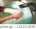Hands of woman wash their hands in a sink with foam to wash the skin and water flows through the hands. Concept of health, cleaning and preventing germs and coronavirus from contacting hands 132211836