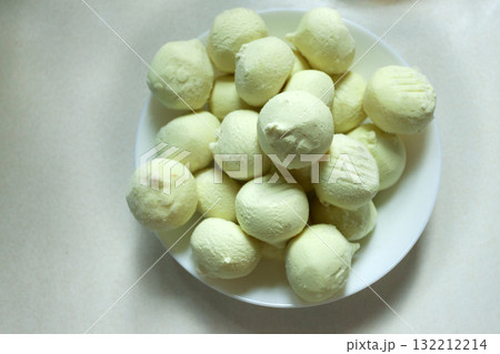 Frozen potato dumplings on a plate Frozen potato dumplings on a plate 132212214