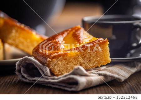 Catalana sponge cake on wooden table. Catalana sponge cake on wooden table. 132212468
