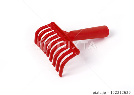 red plastic rake for harvesting olives on white 132212629