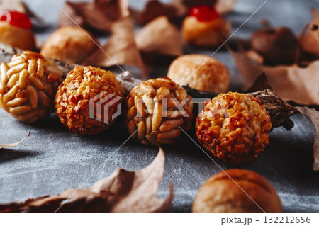 row of Catalan panellets on rustic gray surface row of Catalan panellets on rustic gray surface 132212656