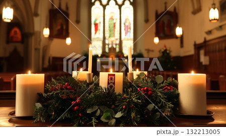 An advent wreath with candles lit on a church altar, decorated with pine branches, symbolizing hope, peace, joy, and love. 132213005
