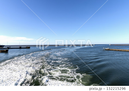Water trail behind cruise ship. Summer travel concept. Water trail behind cruise ship. Summer travel concept. 132215296