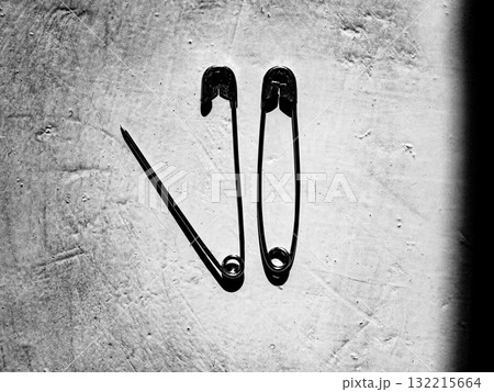 Two safety pins. Still-life. Relationships. Two safety pins. Still-life. Relationships. 132215664