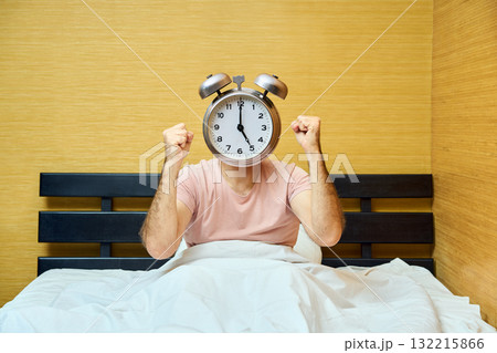 Shocked man with alarm clock instead of head has overslept. Lateness concept Shocked man with alarm clock instead of head has overslept. Lateness concept 132215866