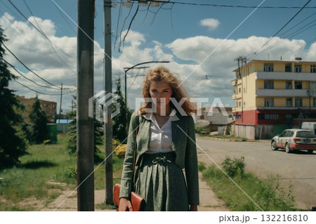 Portrait of a girl standing on a path in suburb 132216810