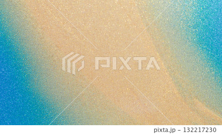 Macro abstract texture showing a soft blue to gold gradient on a shimmering paper surface. Ideal for modern art, branding, or design backgrounds. 132217230