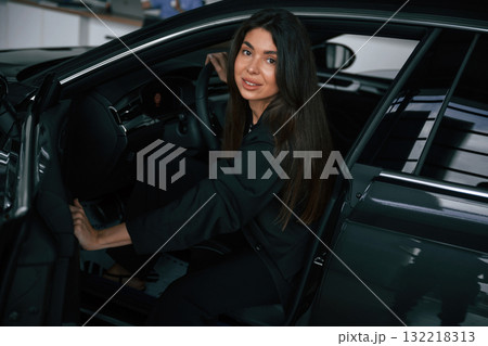 Beautiful businesswoman is in the new car Beautiful businesswoman is in the new car 132218313