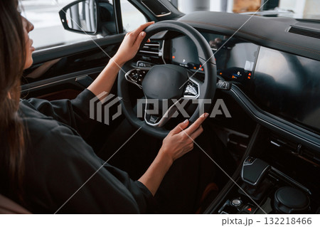 Conception of test drive. Beautiful businesswoman is in the new car 132218466