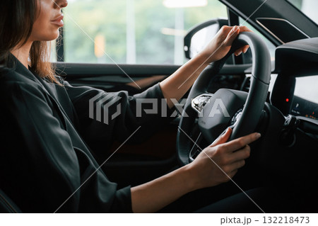 Conception of test drive. Beautiful businesswoman is in the new car 132218473