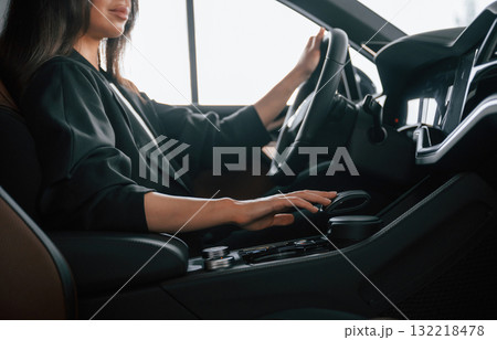 Enjoying the ride. Beautiful businesswoman is in the new car Enjoying the ride. Beautiful businesswoman is in the new car 132218478