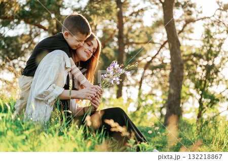 Conception of care and love. Mother and son are in the forest together 132218867