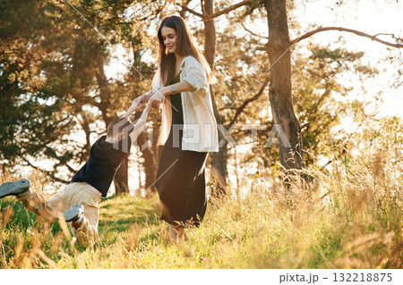 Having fun. Mother and son are in the forest together Having fun. Mother and son are in the forest together 132218875