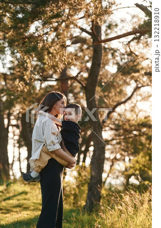 Fun times. Mother and son are in the forest together Fun times. Mother and son are in the forest together 132218910