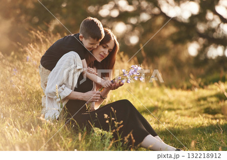 Fun times. Mother and son are in the forest together Fun times. Mother and son are in the forest together 132218912