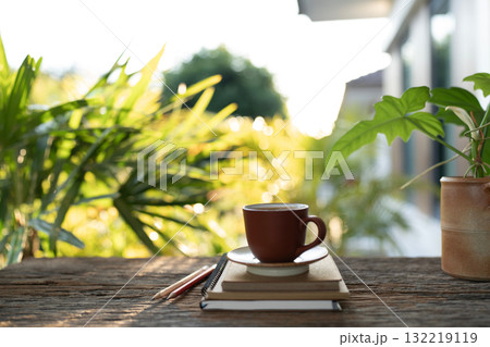 Brown coffee and kraft paper notebooks on a table 132219119