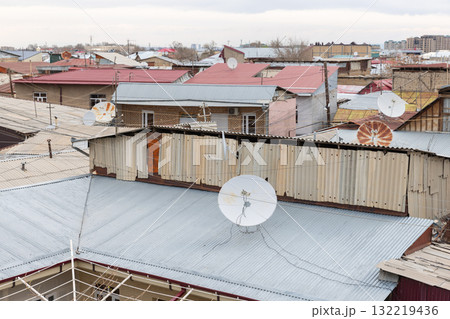 A view over a crowded urban neighborhood featuring corrugated metal roofs A view over a crowded urban neighborhood featuring corrugated metal roofs 132219436