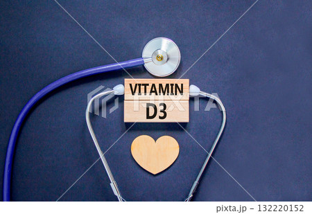 Vitamin D3 symbol. Concept words Vitamin D3 on beautiful wooden blocks. Wooden heart and stethoscope. Beautiful black background. Medical healthy lifestyle Vitamin D3 concept. 132220152