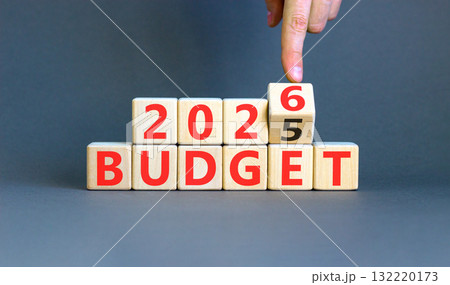 2026 Budget symbol. Concept words 2026 Budget on beautiful wooden blocks. Beautiful grey paper background. Businessman's hand. Business and 2026 budget concept. Copy space. 132220173