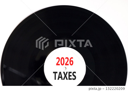 2026 taxes new year symbol. Concept words 2026 taxes on beautiful white and black vinyl disk. Beautiful white paper background. Business and 2026 taxes new year concept. Copy space. 2026 taxes new year symbol. Concept words 2026 taxes on beautiful white and black vinyl disk. Beautiful white paper background. Business and 2026 taxes new year concept. Copy space. 132220209