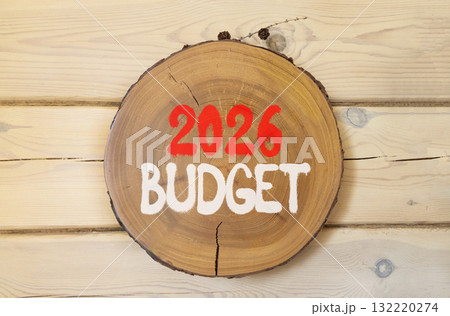 2026 Budget symbol. Concept words 2026 Budget on beautiful wooden circle. Beautiful wooden wall background. Business and 2026 budget concept. Copy space. 2026 Budget symbol. Concept words 2026 Budget on beautiful wooden circle. Beautiful wooden wall background. Business and 2026 budget concept. Copy space. 132220274