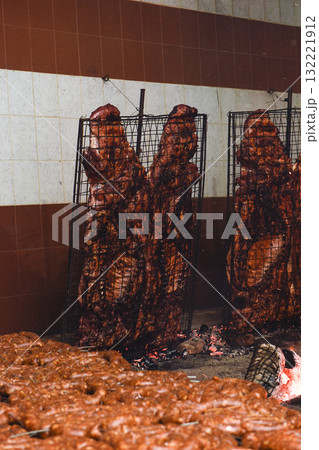 Gaucho roast barbecue, sausage and cow ribs, traditional argentine cuisine, Patagonia, Argentina. 132221912
