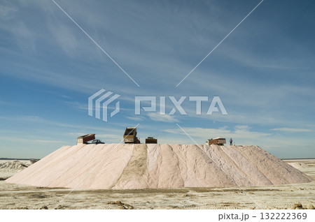 Trucks unloading raw salt bulk, Salinas Grandes de Hidalgo, La Pampa, Argentina. 132222369