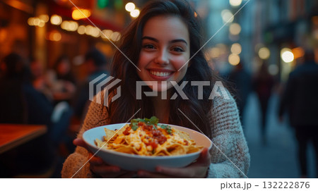 Smiling Woman Enjoying Nachos at Outdoor Restaurant 132222876