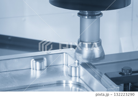 The CNC milling machine rough cutting the aluminum parts by face mill tools in the light blue scene The CNC milling machine rough cutting the aluminum parts by face mill tools in the light blue scene 132223290